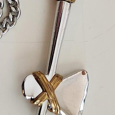 Sale Photo Thumbnail #394: This lot is for an Axe Necklace from Avon.  The axe pendant is nicely executed.  The chain is not marked.