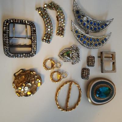 Sale Photo Thumbnail #414: This lot is for a gathering of Vintage Buckles & Bows. This belt buckles and shoe clips are what they are.  Use them as is or make them into whatever you might fancy.  A few gems are missing but it is a nice little collection.