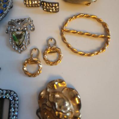 Sale Photo Thumbnail #411: This lot is for a gathering of Vintage Buckles & Bows. This belt buckles and shoe clips are what they are.  Use them as is or make them into whatever you might fancy.  A few gems are missing but it is a nice little collection.