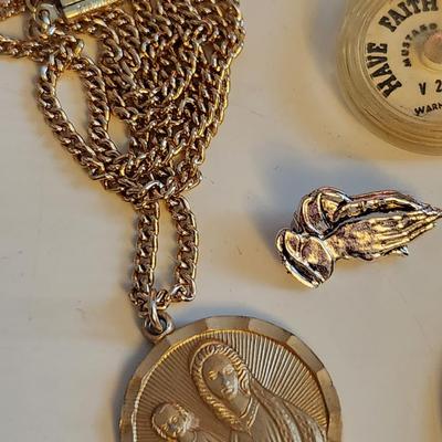 Sale Photo Thumbnail #426: This lot is for a gathering of Vintage Religious Items.  Includes crosses, praying hand and a mustard seed, plus a sweet Mary pin and a Madonna and Child necklace.