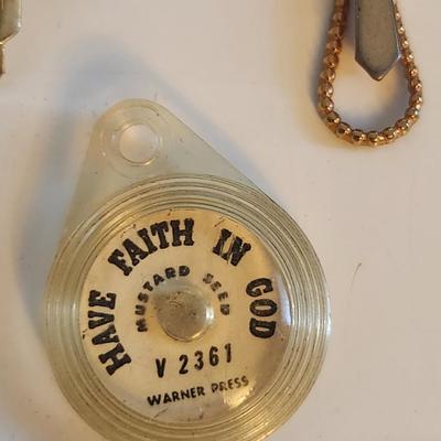 Sale Photo Thumbnail #423: This lot is for a gathering of Vintage Religious Items.  Includes crosses, praying hand and a mustard seed, plus a sweet Mary pin and a Madonna and Child necklace.