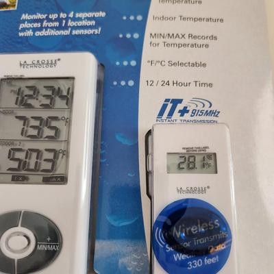 Sale Photo Thumbnail #435: This lot is for a Wireless Temperature Station.  This is a La Crosse Technology Model 9121.  It is new and has not been taken from its original packaging.  Fun item for your favorite weather freak.