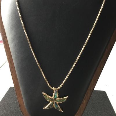 Gold tone starfish necklace abalone like finish