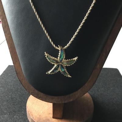 Gold tone starfish necklace abalone like finish