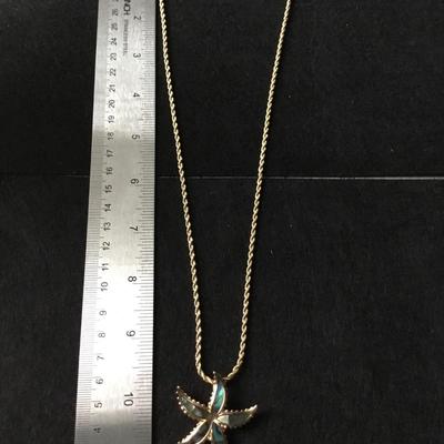 Gold tone starfish necklace abalone like finish