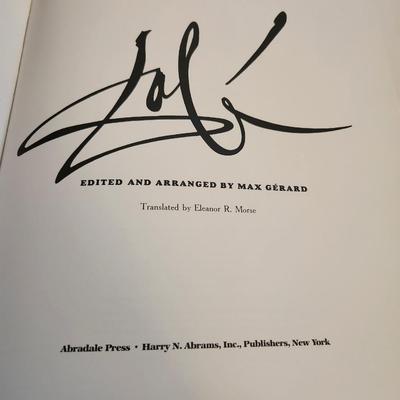 Sale Photo Thumbnail #438: This lot is for a copy of Dali, a beautiful coffee table book.  This large and heavy book has page after page of pictures and information of one of the worlds most recognized artist.  In good condition for its age.