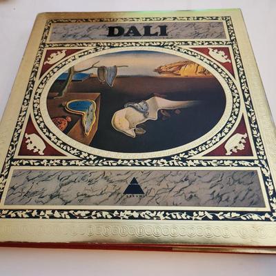 Sale Photo Thumbnail #437: This lot is for a copy of Dali, a beautiful coffee table book.  This large and heavy book has page after page of pictures and information of one of the worlds most recognized artist.  In good condition for its age.