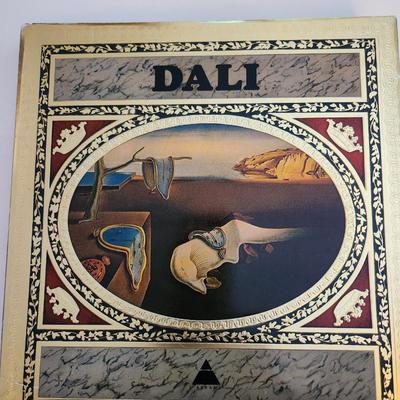 Sale Photo Thumbnail #436: This lot is for a copy of Dali, a beautiful coffee table book.  This large and heavy book has page after page of pictures and information of one of the worlds most recognized artist.  In good condition for its age.
