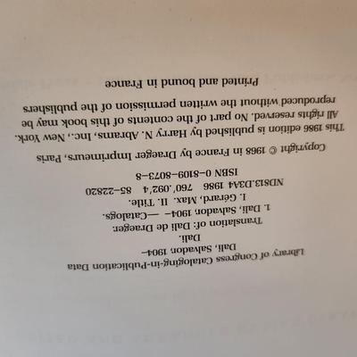 Sale Photo Thumbnail #439: This lot is for a copy of Dali, a beautiful coffee table book.  This large and heavy book has page after page of pictures and information of one of the worlds most recognized artist.  In good condition for its age.