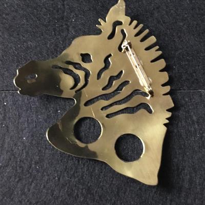 Large zebra unmarked gold tone pin