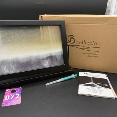 Sale Photo Thumbnail #359: From KB Collection of Austria 
Has the original box and refill instructions
Includes black, white, and gold colored sand that moves when the frame moves on the swivel
Like new condition 
13" x 8.5 "   2 inches deep 
Retails at $150