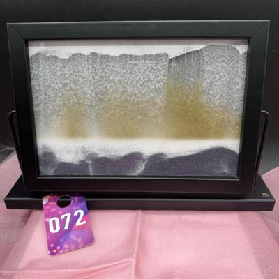 Sale Photo Thumbnail #360: From KB Collection of Austria 
Has the original box and refill instructions
Includes black, white, and gold colored sand that moves when the frame moves on the swivel
Like new condition 
13" x 8.5 "   2 inches deep 
Retails at $150