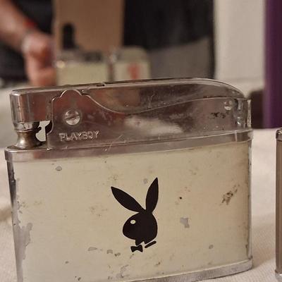 Sale Photo Thumbnail #135: Playboy lighter has some paint loss. 
Balboa lighter advertised for "Rocky" (lol) Mountain Tools
I believe both with work with new flints & a good cleaning & filling.