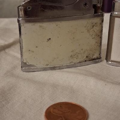 Sale Photo Thumbnail #136: Playboy lighter has some paint loss. 
Balboa lighter advertised for "Rocky" (lol) Mountain Tools
I believe both with work with new flints & a good cleaning & filling.