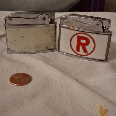 Sale Photo Thumbnail #132: Playboy lighter has some paint loss. 
Balboa lighter advertised for "Rocky" (lol) Mountain Tools
I believe both with work with new flints & a good cleaning & filling.