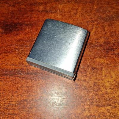 Sale Photo Thumbnail #145: 1960s Zippo Tape measurer. Excellent condition. Tape itself is in excellent condition with the early script Zippo name on the tape. Only slight wear on the case. This item is no longer made. Production stopped in 2007.