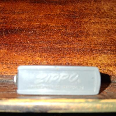 Sale Photo Thumbnail #139: 1960s Zippo Tape measurer. Excellent condition. Tape itself is in excellent condition with the early script Zippo name on the tape. Only slight wear on the case. This item is no longer made. Production stopped in 2007.