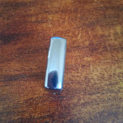 Sale Photo Thumbnail #142: 1960s Zippo Tape measurer. Excellent condition. Tape itself is in excellent condition with the early script Zippo name on the tape. Only slight wear on the case. This item is no longer made. Production stopped in 2007.