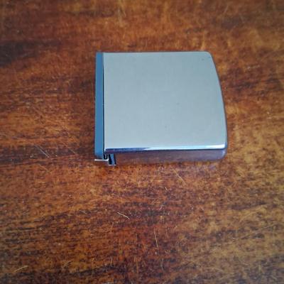 Sale Photo Thumbnail #138: 1960s Zippo Tape measurer. Excellent condition. Tape itself is in excellent condition with the early script Zippo name on the tape. Only slight wear on the case. This item is no longer made. Production stopped in 2007.