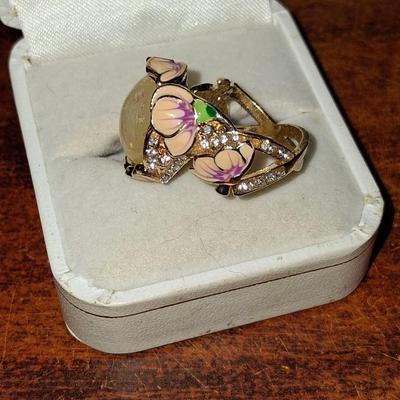 Sale Photo Thumbnail #173: Crystal accents. This ring is statement upon statement.  The Flowers wrap around the ring, flow down the shoulders & are pepper with Crystal accents. Size 7 1/2