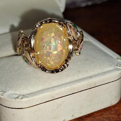 Sale Photo Thumbnail #176: Crystal accents. This ring is statement upon statement.  The Flowers wrap around the ring, flow down the shoulders & are pepper with Crystal accents. Size 7 1/2