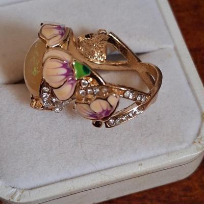 Sale Photo Thumbnail #178: Crystal accents. This ring is statement upon statement.  The Flowers wrap around the ring, flow down the shoulders & are pepper with Crystal accents. Size 7 1/2