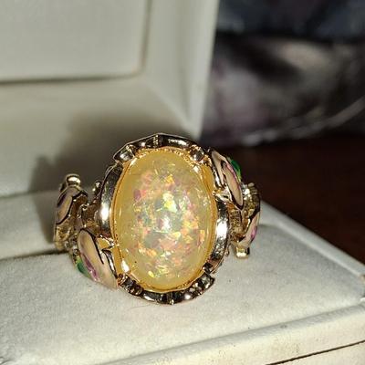 Sale Photo Thumbnail #175: Crystal accents. This ring is statement upon statement.  The Flowers wrap around the ring, flow down the shoulders & are pepper with Crystal accents. Size 7 1/2