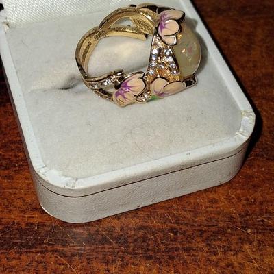 Sale Photo Thumbnail #172: Crystal accents. This ring is statement upon statement.  The Flowers wrap around the ring, flow down the shoulders & are pepper with Crystal accents. Size 7 1/2