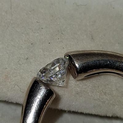 Sale Photo Thumbnail #277: This ring features a beautiful CZ with excellent cut & clarity balance between the tension of the two sides of the band. Features a comfort band that slides on & off comfortably & exceptionally comfortable to wear. 
This Ring has a Gold wash. It is beauti