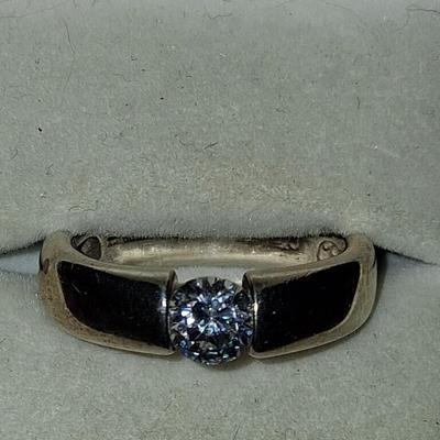 Sale Photo Thumbnail #279: This ring features a beautiful CZ with excellent cut & clarity balance between the tension of the two sides of the band. Features a comfort band that slides on & off comfortably & exceptionally comfortable to wear. 
This Ring has a Gold wash. It is beauti