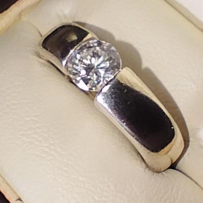 Sale Photo Thumbnail #274: This ring features a beautiful CZ with excellent cut & clarity balance between the tension of the two sides of the band. Features a comfort band that slides on & off comfortably & exceptionally comfortable to wear. 
This Ring has a Gold wash. It is beauti