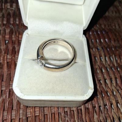 Sale Photo Thumbnail #275: This ring features a beautiful CZ with excellent cut & clarity balance between the tension of the two sides of the band. Features a comfort band that slides on & off comfortably & exceptionally comfortable to wear. 
This Ring has a Gold wash. It is beauti