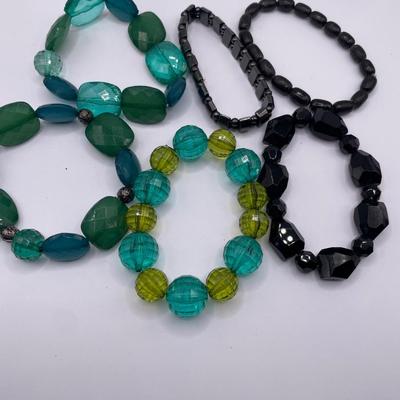 Green and black stretch bracelets