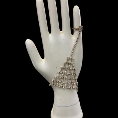 Sale Photo Thumbnail #323: Silver toned Rhinestone Hand Chain Bracelet with an attached ring