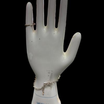 Sale Photo Thumbnail #322: Silver toned Rhinestone Hand Chain Bracelet with an attached ring