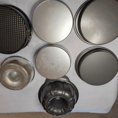 Sale Photo Thumbnail #97: 7 PC Baking Lot:

4 Round baking pans
2 Bundt Pans 
1 spring form pan 

baking pans measure: 9.5"x2" deep, and 8.5"x2" deep 
Small Bundt pan measures: 8"x3" deep 
Large Bundt Pan measures: 10.5"x3.5" deep 
Spring Form Pan measures: 9.5"x 3" deep
