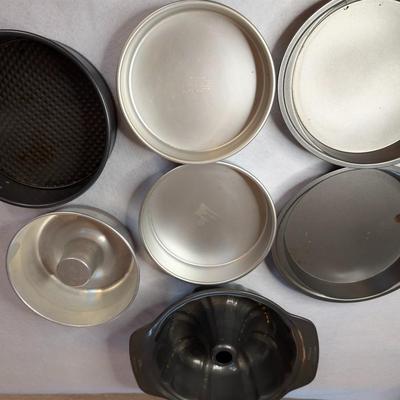 Sale Photo Thumbnail #98: 7 PC Baking Lot:

4 Round baking pans
2 Bundt Pans 
1 spring form pan 

baking pans measure: 9.5"x2" deep, and 8.5"x2" deep 
Small Bundt pan measures: 8"x3" deep 
Large Bundt Pan measures: 10.5"x3.5" deep 
Spring Form Pan measures: 9.5"x 3" deep