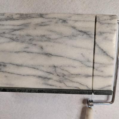 Sale Photo Thumbnail #120: Marble cheese slicer 
comes w/ 2 extra slicing wires 
9x6x1