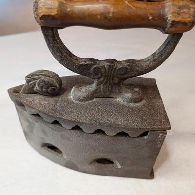 Sale Photo Thumbnail #135: Vintage Cast Iron Charcoal or Coal Iron 

Top portion coming off slightly on one side