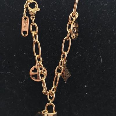Louis Vuitton Lock and key bracelet 18 karat gold over stainless steel