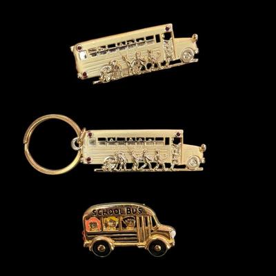 Sale Photo Thumbnail #432: Two School Bus Brooches and One School Bus Key Ring