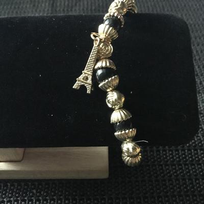 Gold tone and black beaded Eiffel Tower charm bracelet