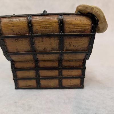 Sale Photo Thumbnail #241: Accents Trunk Music Box 
depicts items in a trunk- boots on hat box spin when melody plays