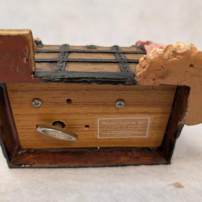 Sale Photo Thumbnail #243: Accents Trunk Music Box 
depicts items in a trunk- boots on hat box spin when melody plays