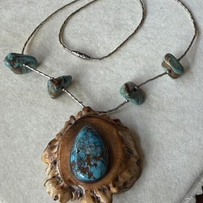 Sale Photo Thumbnail #389: Beautiful turquoise stone on Elk antler, with liquid silver and turquoise nuggets 
on the 16" chain.  Very nice condition.
Statement piece.
