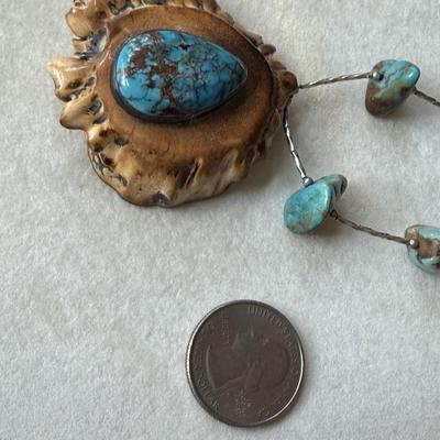 Sale Photo Thumbnail #390: Beautiful turquoise stone on Elk antler, with liquid silver and turquoise nuggets 
on the 16" chain.  Very nice condition.
Statement piece.