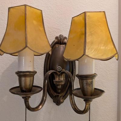 Sale Photo Thumbnail #305: Vintage Brass colored wall sconce w/ amber shades 
untested 
Lamps 9" 
Base 7"
Shades 4x4