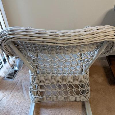 Sale Photo Thumbnail #320: Set of 2 wicker rocking chairs w/ side table 
indoor/outdoor (only used indoors)
excellent condition-no signs of wear 
chairs: 34" high x 26" wide
seat 20" x 20"
Table 20" high x 20" tabletop