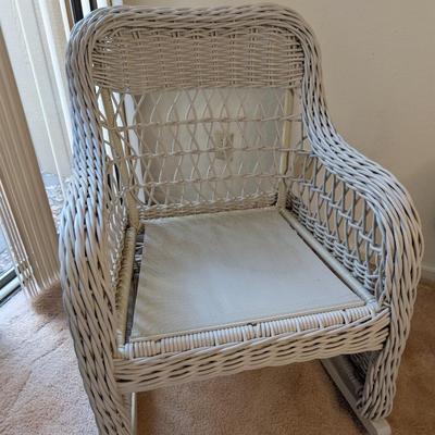 Sale Photo Thumbnail #318: Set of 2 wicker rocking chairs w/ side table 
indoor/outdoor (only used indoors)
excellent condition-no signs of wear 
chairs: 34" high x 26" wide
seat 20" x 20"
Table 20" high x 20" tabletop