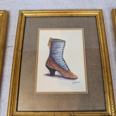 Sale Photo Thumbnail #363: 4 pc shoe decor lot 
contains 3 Peggy Abrams Victorian Shoe Prints 
3 framed shoe prints
1 shoe shaped vase